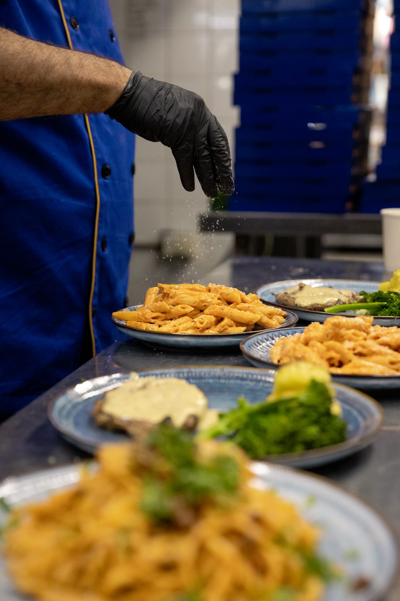 Chef plating dishes in the Babylon kitchen